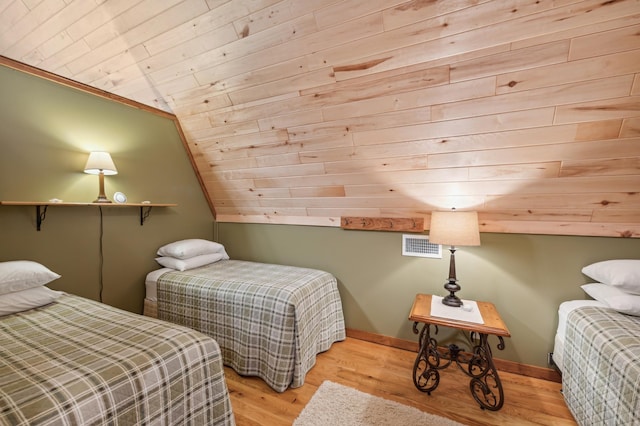 2929 170th St, Frederic, WI 54837 - bedroom featuring wood ceiling, vaulted ceiling, wood finished floors, and baseboards
