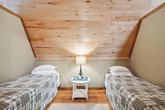 2929 170th St, Frederic, WI 54837 - bedroom with wooden ceiling, wood finished floors, and vaulted ceiling