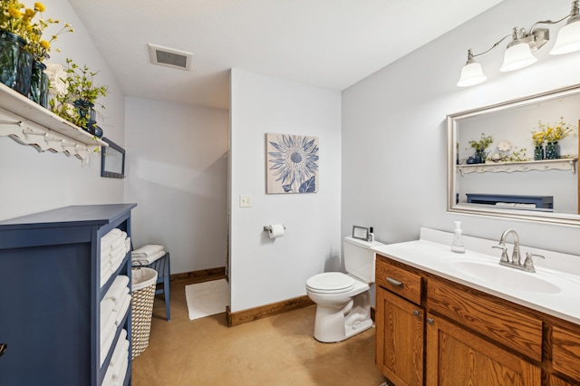 2929 170th St, Frederic, WI 54837 - bathroom featuring toilet, vanity, and baseboards