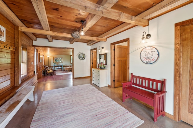 2929 170th St, Frederic, WI 54837 - corridor with wooden ceiling with exposed beams, wood walls, and finished concrete floors