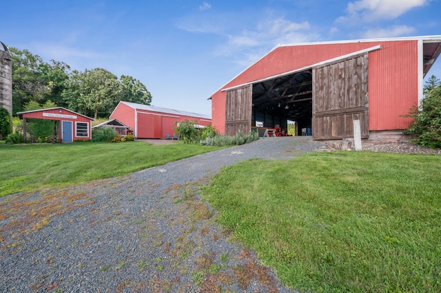 2929 170th St, Frederic, WI 54837 - view of pole building featuring a yard and driveway