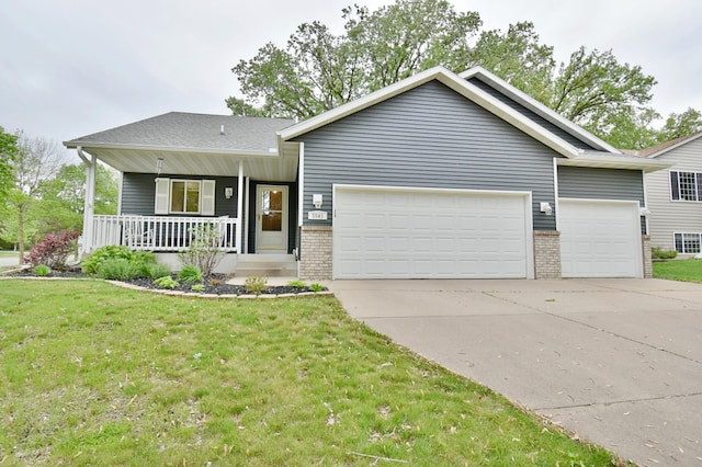 3541 17th Ave S, Saint Cloud, MN 56301 - view of front of home featuring an attached garage, brick siding, driveway, a front lawn, and a porch