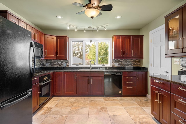 kitchen with black appliances, a sink, dark brown cabinets, and recessed lighting