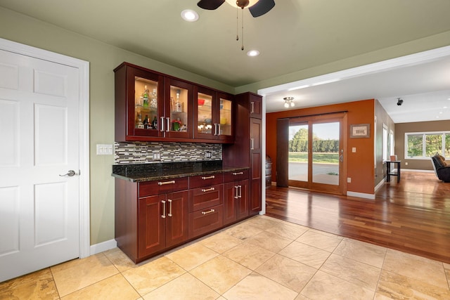 bar with ceiling fan, baseboards, backsplash, recessed lighting, and light wood-type flooring
