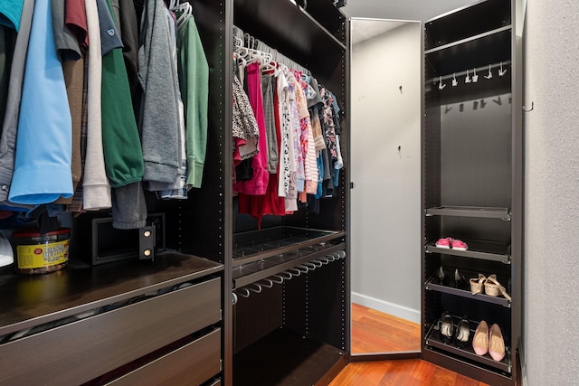 spacious closet with wood finished floors