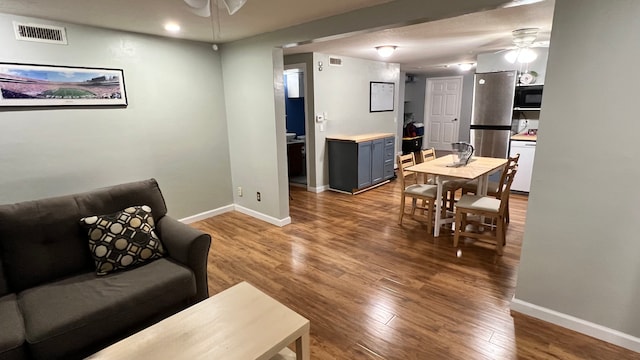 1824 5th St Unit A, Minneapolis, MN 55454 - living area with a ceiling fan, baseboards, and wood finished floors