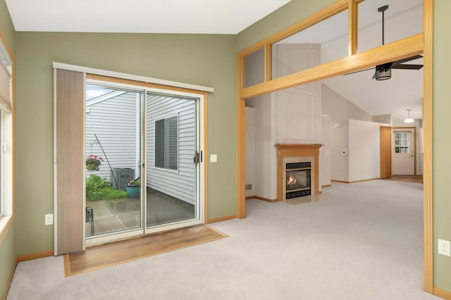 9432 Prairieview Trl N, Champlin, MN 55316 - entryway with lofted ceiling, carpet flooring, a fireplace with flush hearth, and baseboards