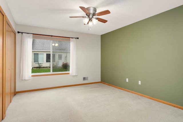 9432 Prairieview Trl N, Champlin, MN 55316 - empty room with light carpet, baseboards, and ceiling fan