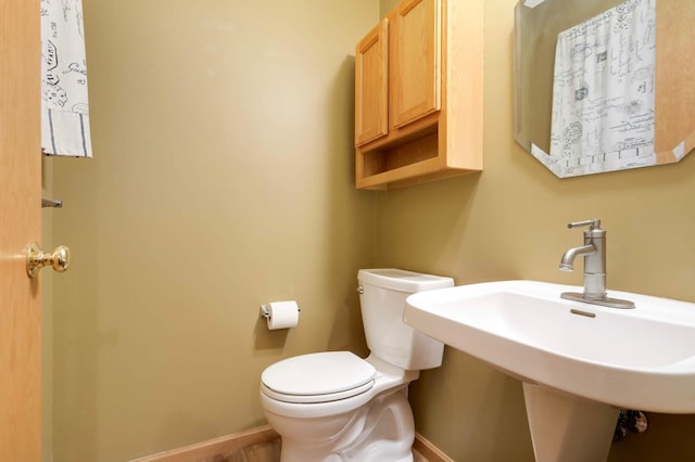 9432 Prairieview Trl N, Champlin, MN 55316 - bathroom with toilet, baseboards, and a sink