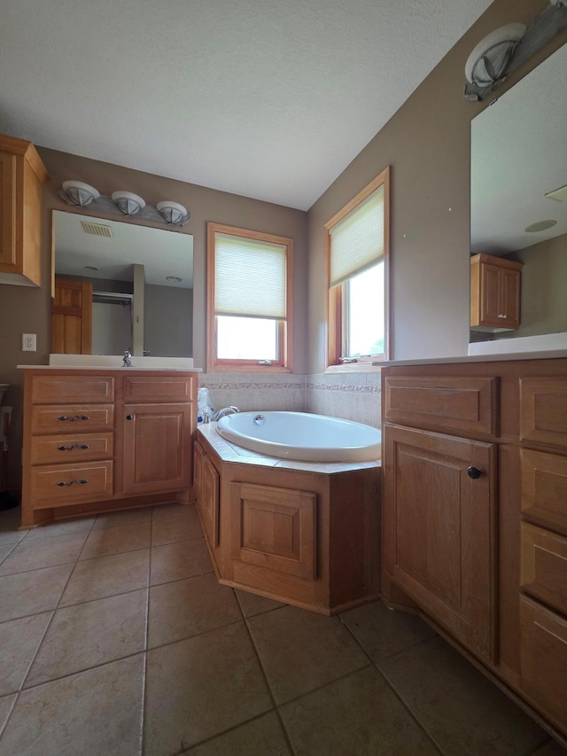 7390 360th St, North Branch, MN 55056 - bathroom with tile patterned floors, a garden tub, and vanity