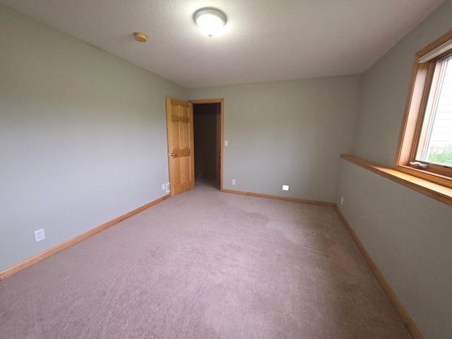 7390 360th St, North Branch, MN 55056 - empty room with light carpet, baseboards, and a smoke detector