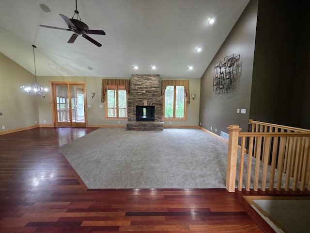 7390 360th St, North Branch, MN 55056 - unfurnished living room featuring a ceiling fan, a chandelier, a fireplace, high vaulted ceiling, and wood finished floors