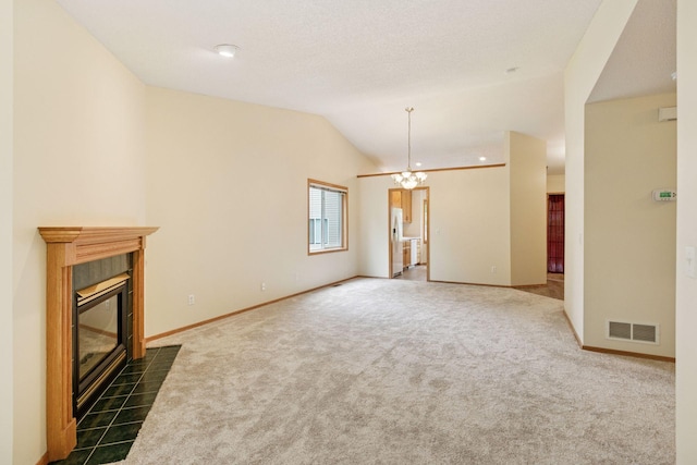 934 105th Ave NW, Coon Rapids, MN 55433 - unfurnished living room with a fireplace, dark carpet, a chandelier, baseboards, and vaulted ceiling