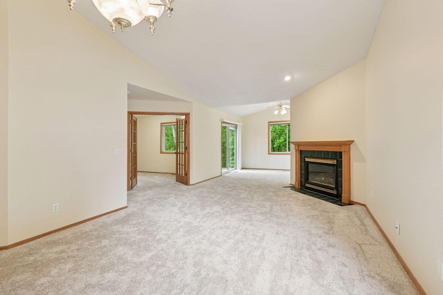934 105th Ave NW, Coon Rapids, MN 55433 - unfurnished living room featuring ceiling fan, lofted ceiling, light colored carpet, a fireplace, and baseboards