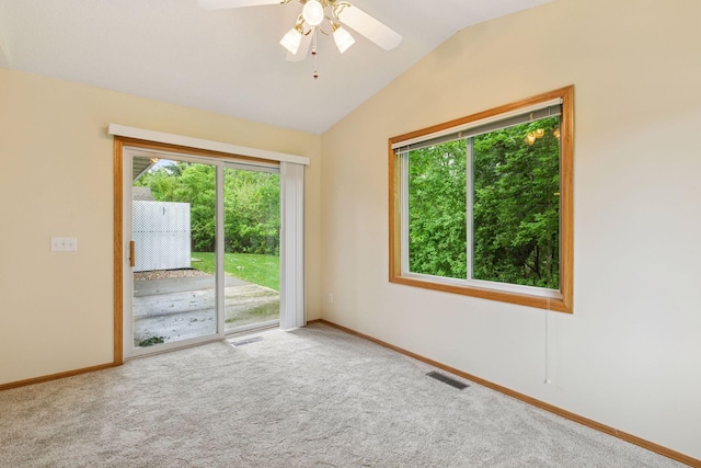 934 105th Ave NW, Coon Rapids, MN 55433 - carpeted spare room featuring healthy amount of natural light, lofted ceiling, baseboards, and a ceiling fan