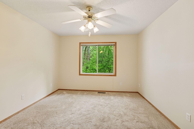 934 105th Ave NW, Coon Rapids, MN 55433 - carpeted empty room featuring baseboards, ceiling fan, and a textured ceiling