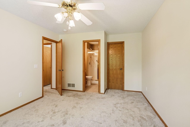 934 105th Ave NW, Coon Rapids, MN 55433 - unfurnished bedroom with carpet, connected bathroom, ceiling fan, and baseboards