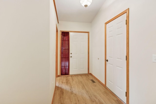 934 105th Ave NW, Coon Rapids, MN 55433 - doorway with light wood-type flooring and baseboards