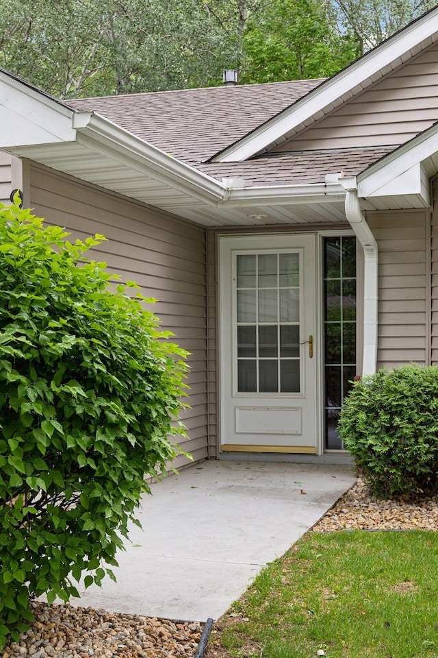 934 105th Ave NW, Coon Rapids, MN 55433 - property entrance featuring a shingled roof