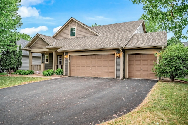 10025 Toledo Dr N, Brooklyn Park, MN 55443 - view of front of home with a garage, driveway, and a shingled roof