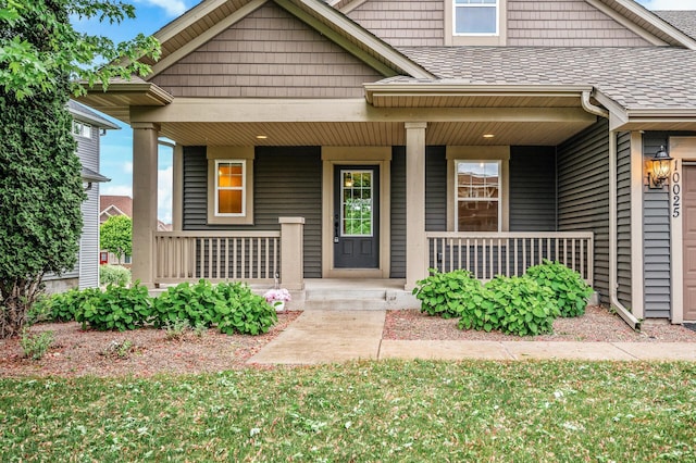 10025 Toledo Dr N, Brooklyn Park, MN 55443 - view of front of house featuring covered porch and a shingled roof