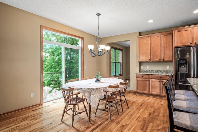 10025 Toledo Dr N, Brooklyn Park, MN 55443 - dining room with a chandelier, light wood finished floors, baseboards, a textured ceiling, and recessed lighting