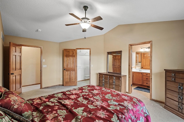 10025 Toledo Dr N, Brooklyn Park, MN 55443 - bedroom with lofted ceiling, light colored carpet, baseboards, ensuite bath, and ceiling fan