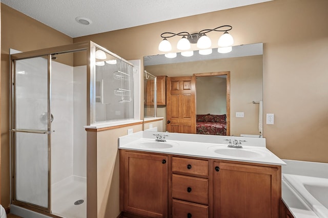 10025 Toledo Dr N, Brooklyn Park, MN 55443 - full bath featuring connected bathroom, a shower stall, double vanity, a bath, and a textured ceiling