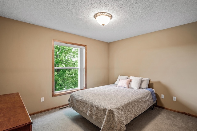 10025 Toledo Dr N, Brooklyn Park, MN 55443 - bedroom with carpet flooring, baseboards, and a textured ceiling