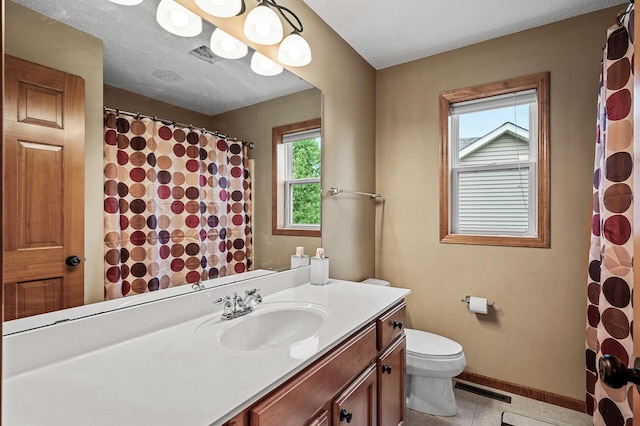 10025 Toledo Dr N, Brooklyn Park, MN 55443 - bathroom with vanity, toilet, baseboards, tile patterned flooring, and curtained shower