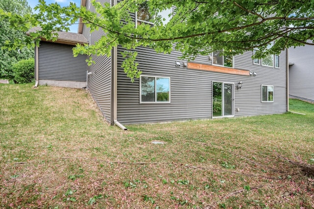 10025 Toledo Dr N, Brooklyn Park, MN 55443 - back of house featuring a lawn