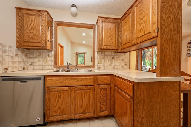 3760 Trenton Ln N, Plymouth, MN 55441 - kitchen featuring dishwasher, light countertops, brown cabinets, and a textured ceiling