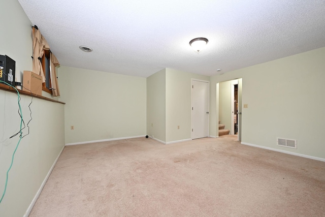 3760 Trenton Ln N, Plymouth, MN 55441 - unfurnished living room with light carpet, stairway, and a textured ceiling