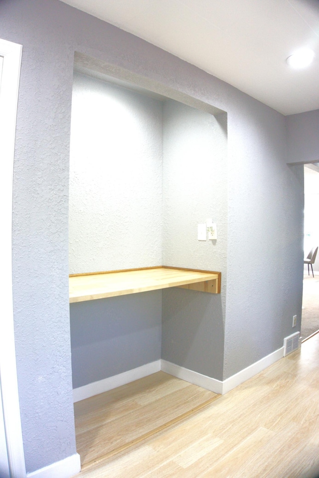 5252 Queen Ave N, Minneapolis, MN 55430 - interior space featuring wood finished floors, a desk, and a textured wall