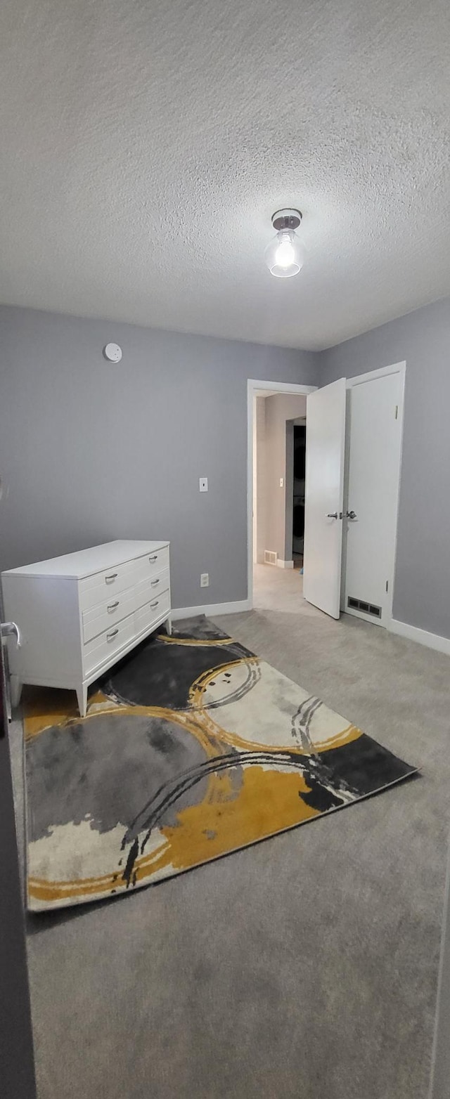 5252 Queen Ave N, Minneapolis, MN 55430 - bedroom featuring a textured ceiling and light carpet