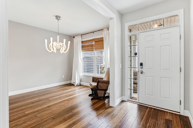 11632 Riverstone Trl, Woodbury, MN 55129 - entrance foyer featuring a chandelier, wood finished floors, and baseboards