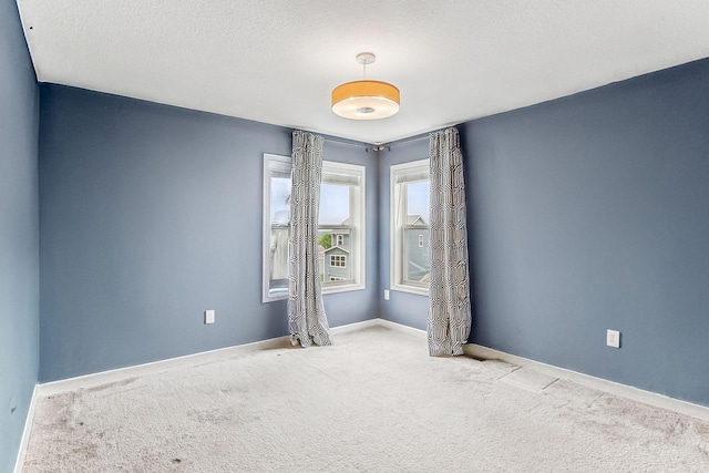 11632 Riverstone Trl, Woodbury, MN 55129 - carpeted spare room with baseboards