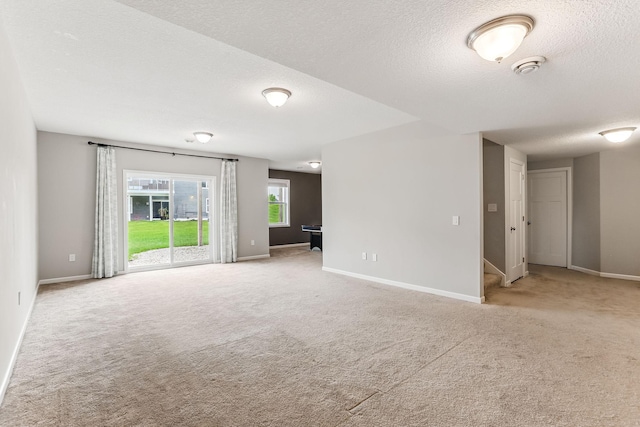 11632 Riverstone Trl, Woodbury, MN 55129 - empty room featuring carpet, a textured ceiling, baseboards, and a smoke detector