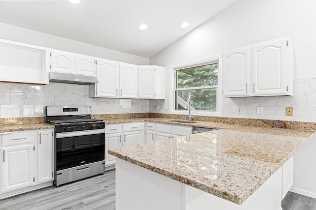 500 Ridge Ln, Chaska, MN 55318 - kitchen with stainless steel gas stove, light stone counters, a peninsula, lofted ceiling, and under cabinet range hood