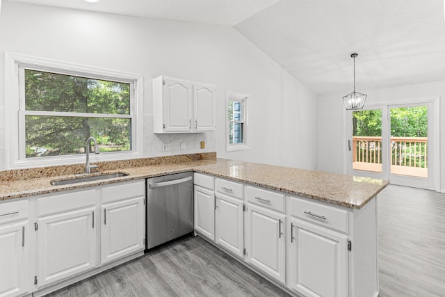 500 Ridge Ln, Chaska, MN 55318 - kitchen with dishwasher, a sink, a peninsula, light wood-type flooring, and white cabinetry
