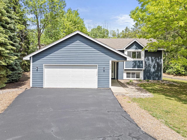 500 Ridge Ln, Chaska, MN 55318 - view of front of property with driveway, a front lawn, and an attached garage