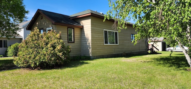 503 5th St SE, Staples, MN 56479 - view of side of property featuring a lawn