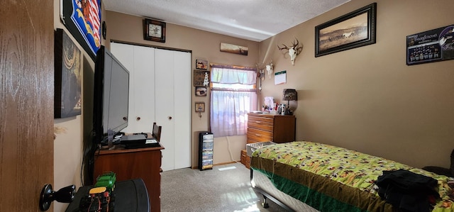 503 5th St SE, Staples, MN 56479 - carpeted bedroom with a textured ceiling and a closet