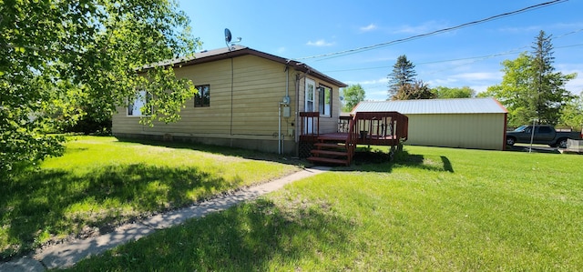 503 5th St SE, Staples, MN 56479 - back of property featuring a deck and a lawn