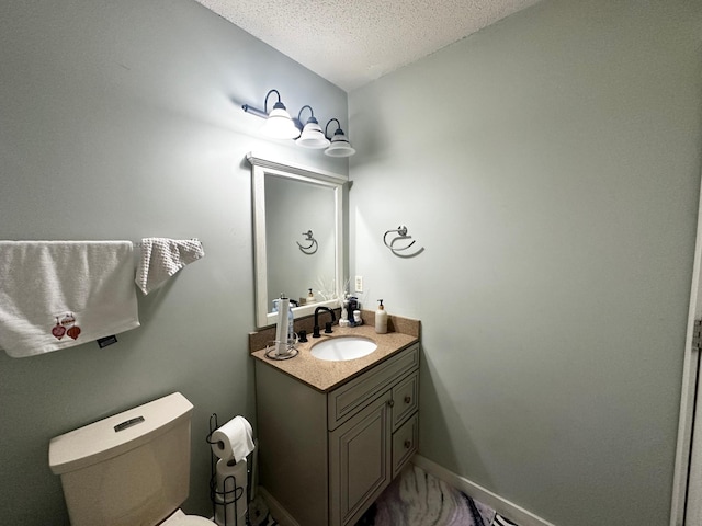 1784 Sandstone Curv, Shakopee, MN 55379 - half bath featuring vanity, toilet, a textured ceiling, and baseboards