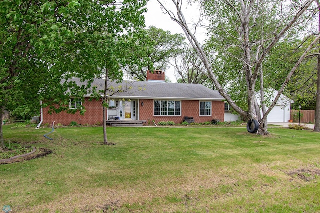 1513 40th Ave N, Moorhead, MN 56560 - single story home with brick siding, a chimney, a front yard, and a garage