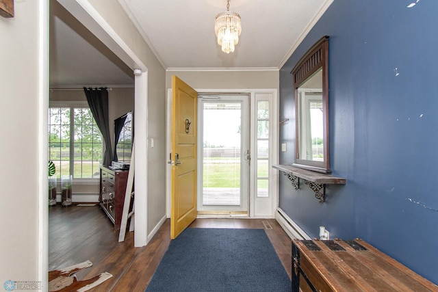1513 40th Ave N, Moorhead, MN 56560 - entrance foyer featuring dark wood-style flooring, crown molding, a chandelier, a baseboard heating unit, and baseboards
