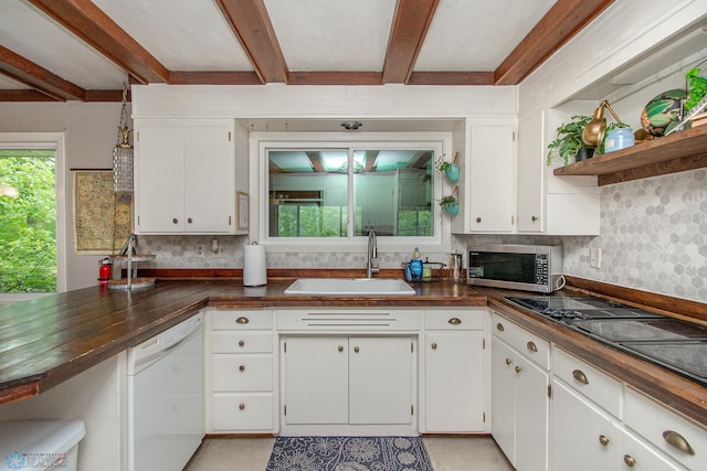 1513 40th Ave N, Moorhead, MN 56560 - kitchen with a sink, stainless steel microwave, dishwasher, beam ceiling, and open shelves
