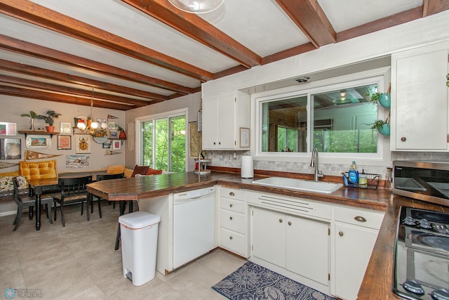 1513 40th Ave N, Moorhead, MN 56560 - kitchen featuring white dishwasher, a sink, stainless steel microwave, dark countertops, and beam ceiling