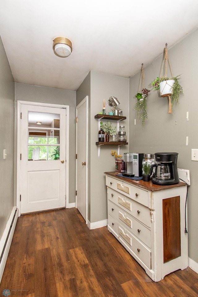 1513 40th Ave N, Moorhead, MN 56560 - entryway featuring a baseboard radiator, dark wood finished floors, and baseboards